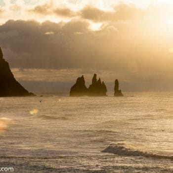 View of Reynisdrangar rock formations in Iceland during sunrise