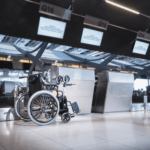 Wheelchair by check in desk at the airport. Why you should book special assistance when travelling with a disability