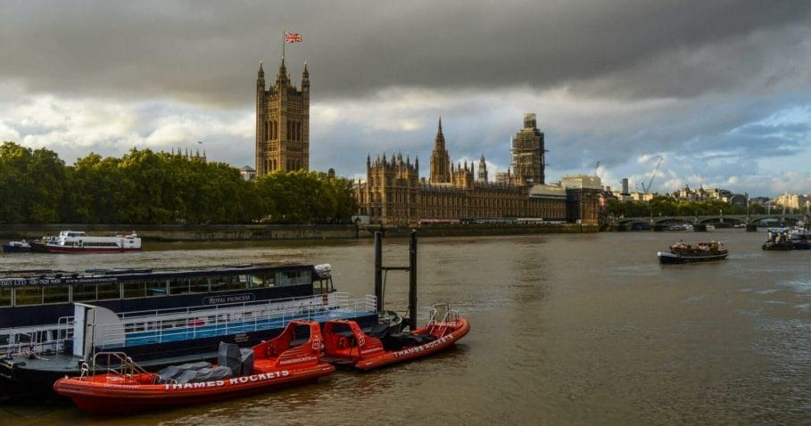 Rib speed boats moored up on the river themes