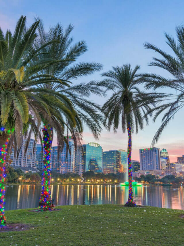 Orlando, Florida, USA downtown skyline at Eola Lake.