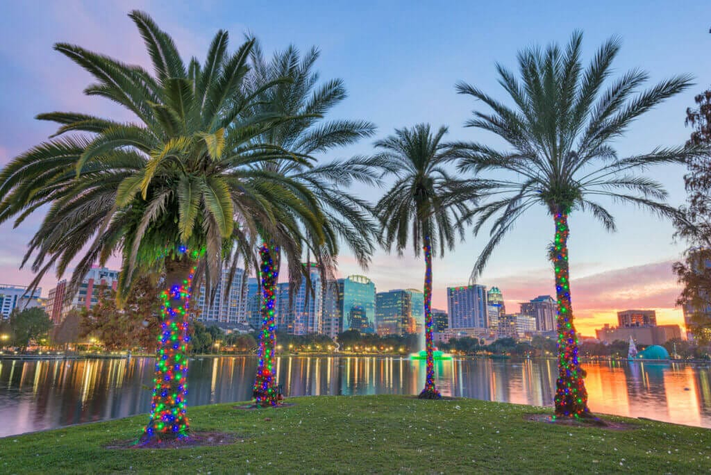 Orlando, Florida, USA downtown skyline at Eola Lake.