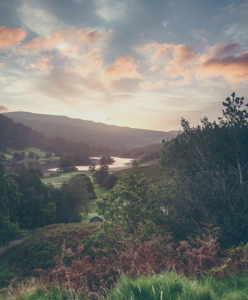 Sun rising over the mountains around Rydal Water in Lake District