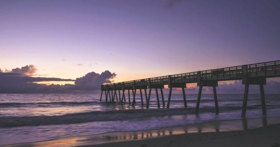 Vero Beach Pier at night with a purple hazy sunset