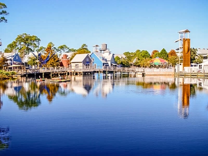 Photo of the waters at Baytowne Wharf, with the wharf reflected in the calm blue water.