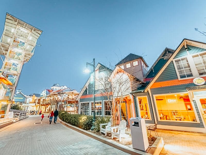 Photo of Destin harbor broadwalk, showing different shops.