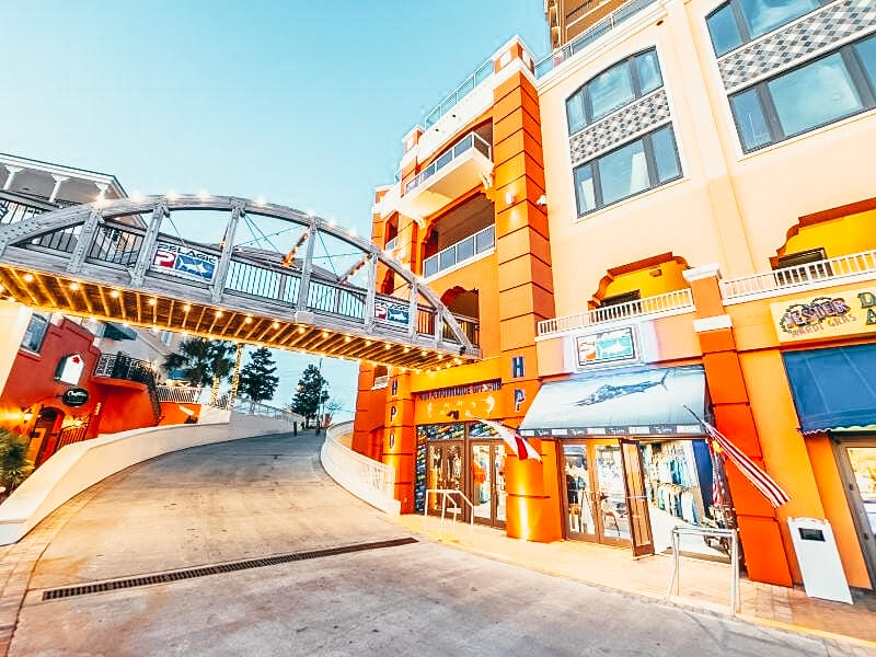 Photo of Destin harbor broadwalk, showing different shops.