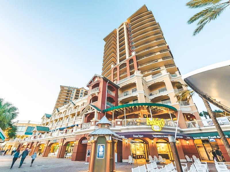 Photo of Destin harbor broadwalk, showing different shops.