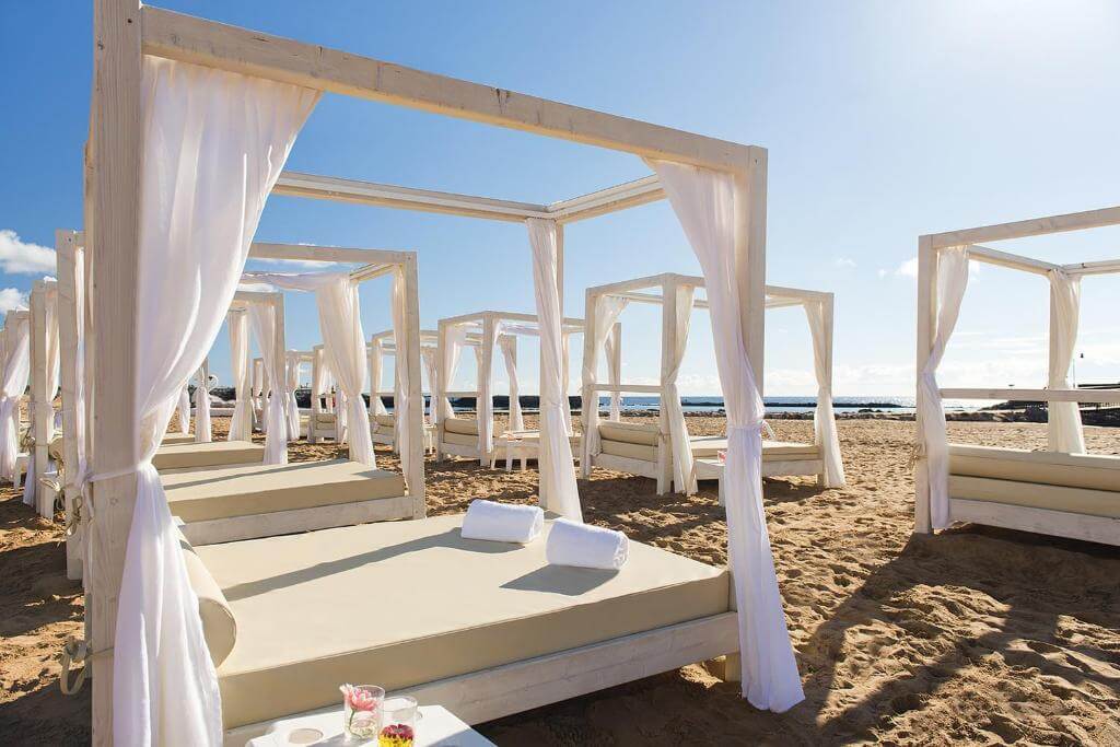 Sunloungers on the beach at the Elba Carlota Beach Resort