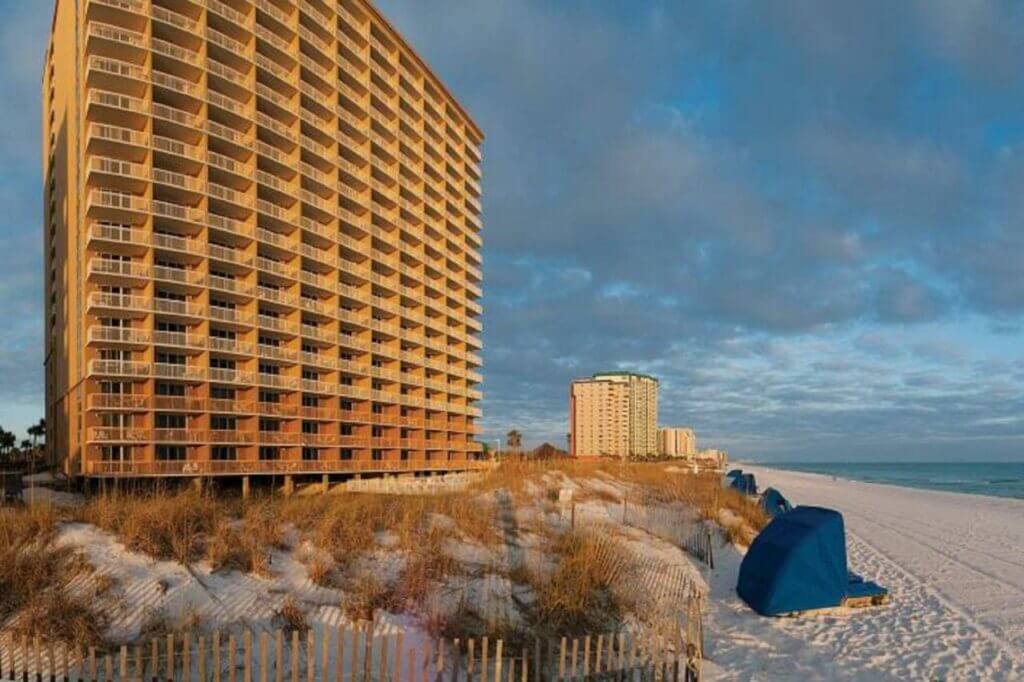 view of the beach and hotel at the Pelican Beach Resort