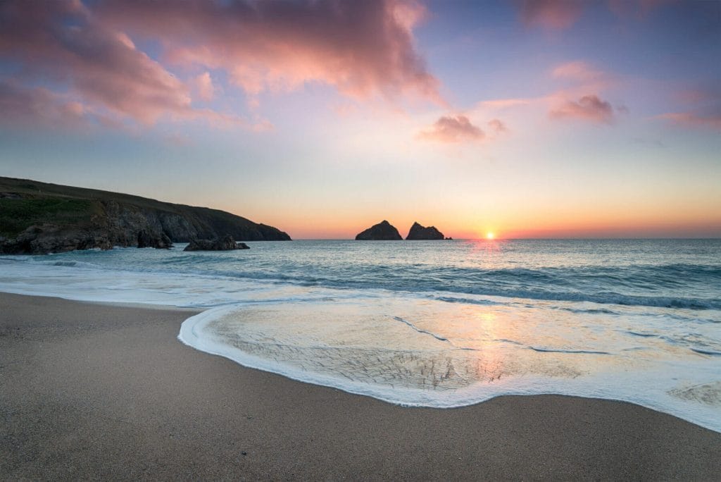 Dramatic sunset at Holywell Bay, a large sandy beach near Newquay in Cornwall