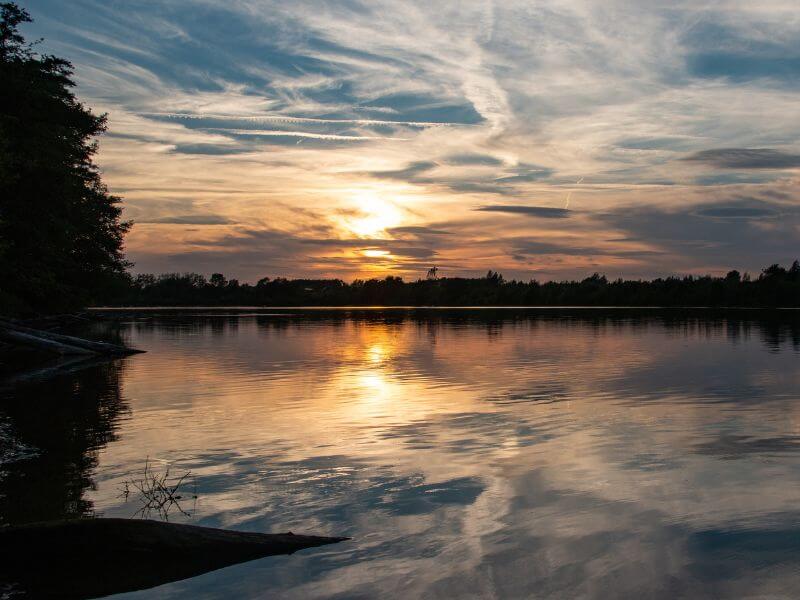 Sunset over a lake in the Cotswolds