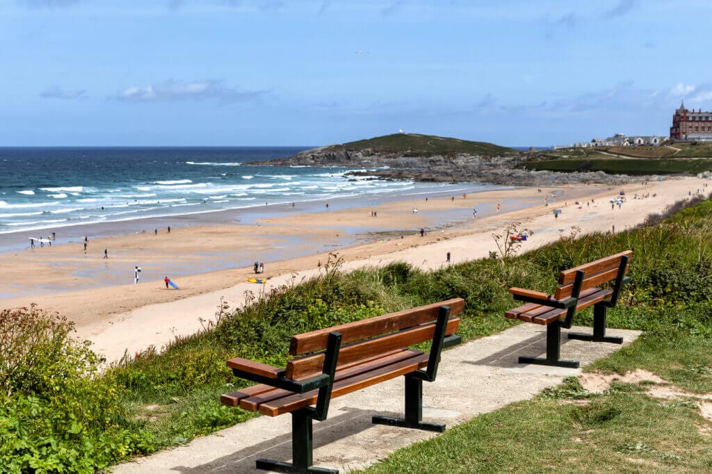 view from the south west coast path towards Newquay Beach in Cornwall UK 