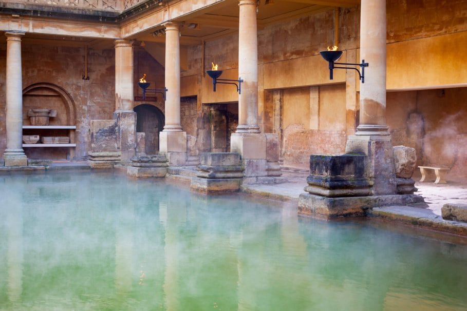 Steam rising off the hot  mineral water in the Great Bath, part of the Roman Baths in Bath, UK