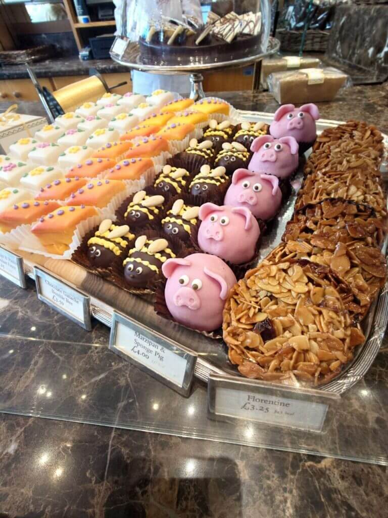 Cute marzipan cakes shaped like pigs, and bees in bettys tea room shop