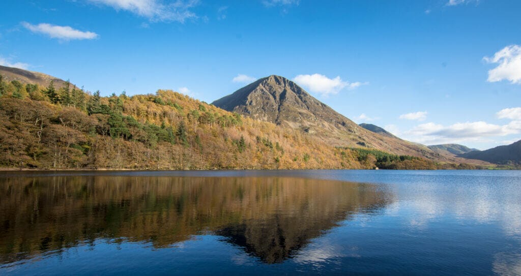 A mountain is reflected in a lake at Crummock water