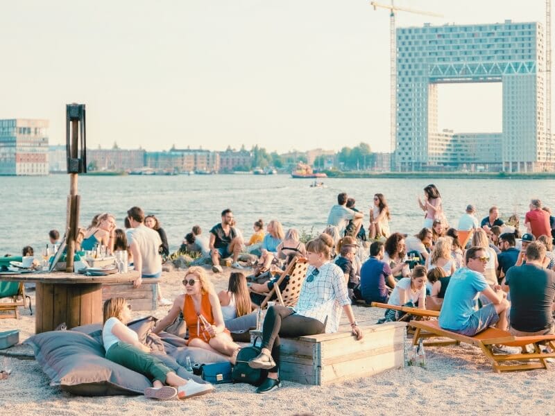 People sat around drinking and eating at NDSM