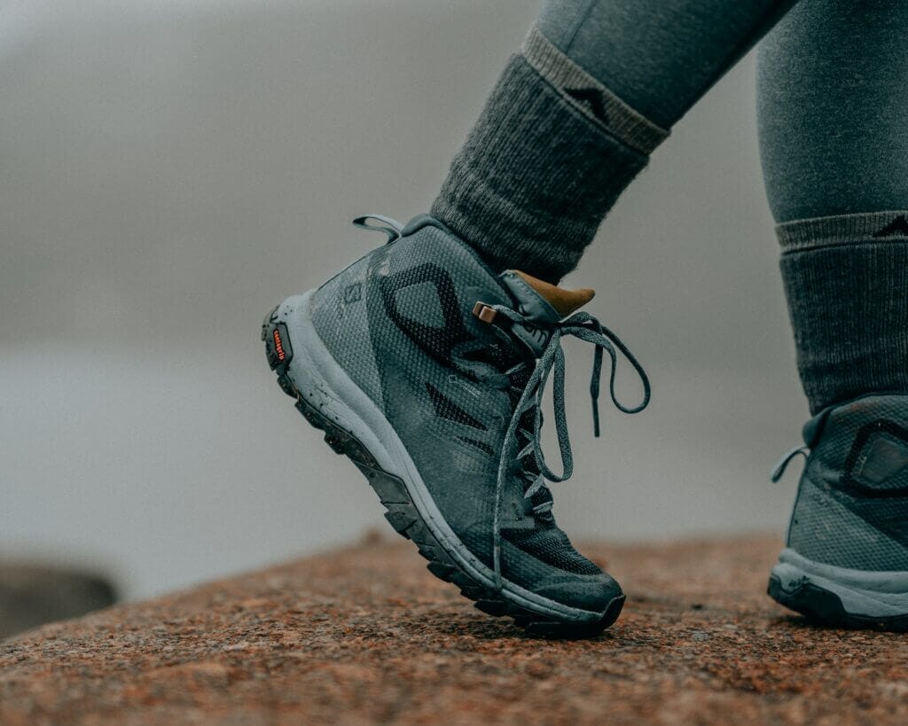 person in gray nike hiking shoes